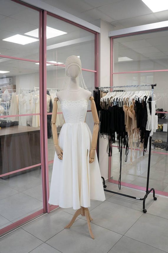 pearl corset dress Strapless Sequin Maxi Nude Pink Clean architectural lines are balanced by soft draping PEARL IVORY CORSET GOWN |