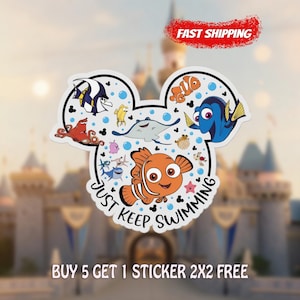 May include: A white sticker in the shape of Mickey Mouse ears, featuring cartoon fish characters. The sticker includes the text "Just Keep Swimming" and the words "Fast Shipping" in a red banner.