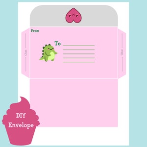 May include: A DIY envelope template with a pink background and a light gray flap. The envelope features a green dinosaur illustration, a peach graphic, and the words "From" and "To". The bottom left corner has a pink cupcake graphic with the words "DIY Envelope".