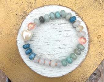 Beaded rondelle necklace with gemstones paired with matching bracelet am ceramic ivory heart
