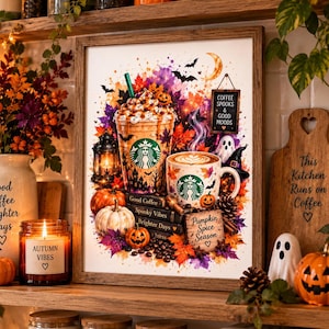 May include: A framed wall art print featuring a watercolour-style illustration of a Starbucks iced coffee and a mug, surrounded by pumpkins, autumn leaves, bats, and a ghost. The text reads Coffee Spooks & Good Moods and Pumpkin Spice Season.