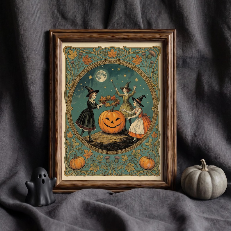 May include: A framed art print featuring three figures in pointed hats surrounding a large jack-o'-lantern under a full moon. The illustration is enclosed in a circular border with decorative autumn leaves, thistles, and two smaller pumpkins.