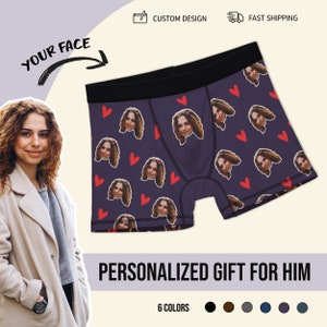 May include: Purple boxer shorts with a repeating pattern of red hearts and a woman's face. The text "YOUR FACE" is written on the image.
