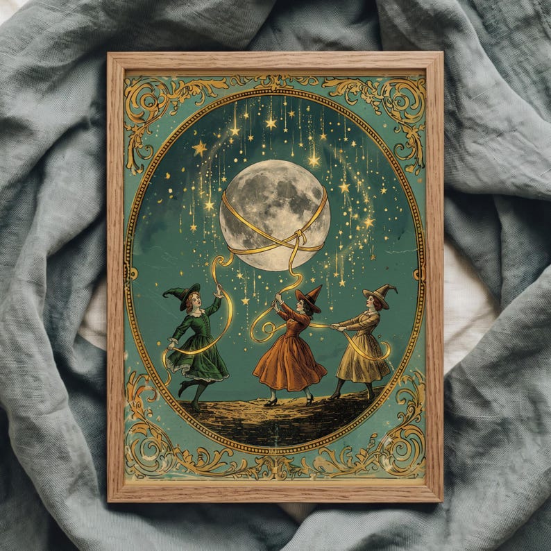 May include: A framed rectangular print featuring three figures in dresses and pointed hats holding golden ribbons connected to a large moon. The scene is set against a teal background with gold stars and an ornate gold border in a wooden frame.
