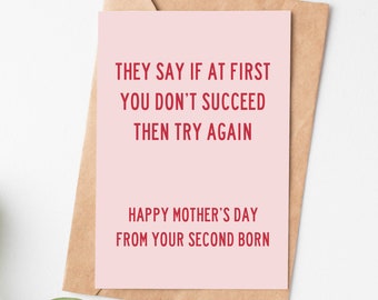 May include: A pink card with the text "THEY SAY IF AT FIRST YOU DON'T SUCCEED THEN TRY AGAIN" and "HAPPY MOTHER'S DAY FROM YOUR SECOND BORN" in red.