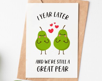 May include: A white card with the text "1 year later" and two green pear illustrations with red hearts above them. The text "and we're still a great pear" is below the pears.