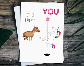May include: A greeting card with a unicorn on a pole dancing with a star on top. The text "YOU" is above the unicorn and "OTHER FRIENDS" is to the left of a brown horse.
