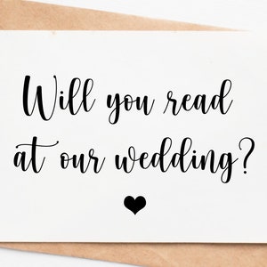 May include: A white card with black text that reads "Will you read at our wedding?" with a small black heart below the text.