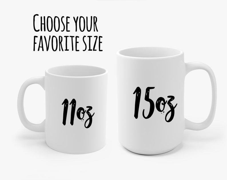 May include: Two white ceramic mugs with black lettering. The mug on the left says "11oz" and the mug on the right says "15oz".