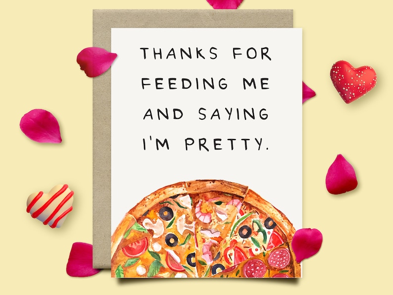May include: A white card with the text "Thanks for feeding me and saying I'm pretty."  A watercolor illustration of a pizza with various toppings is at the bottom of the card.