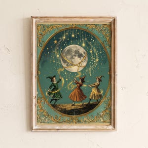 May include: A framed rectangular wall art print featuring three figures in pointed hats and dresses holding golden ribbons connected to a large moon. The scene is set against a dark teal background with falling stars and ornate gold filigree borders.