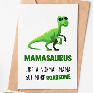 May include: A green dinosaur wearing sunglasses with the text "Mamasaurus Like a normal mama but more roarsome".