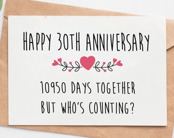 May include: A white card with black text that reads "Happy 30th Anniversary 10950 Days Together But Who's Counting?" with a pink heart and floral design.