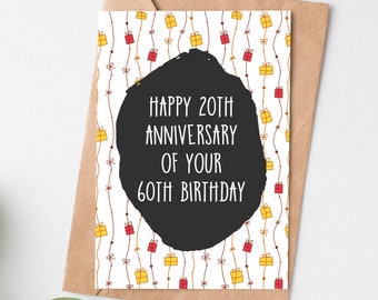 May include: A white card with a black circle in the center. The circle has the text "Happy 20th Anniversary of your 60th Birthday" in white. The background of the card is a white pattern of red and yellow gift boxes.