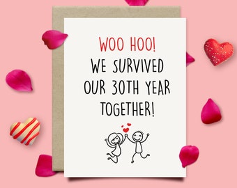 May include: A white card with black text that reads "Woo Hoo! We survived our 30th year together!"  A simple stick figure drawing of a couple holding hands and jumping for joy is below the text.  There are small red hearts above the couple.