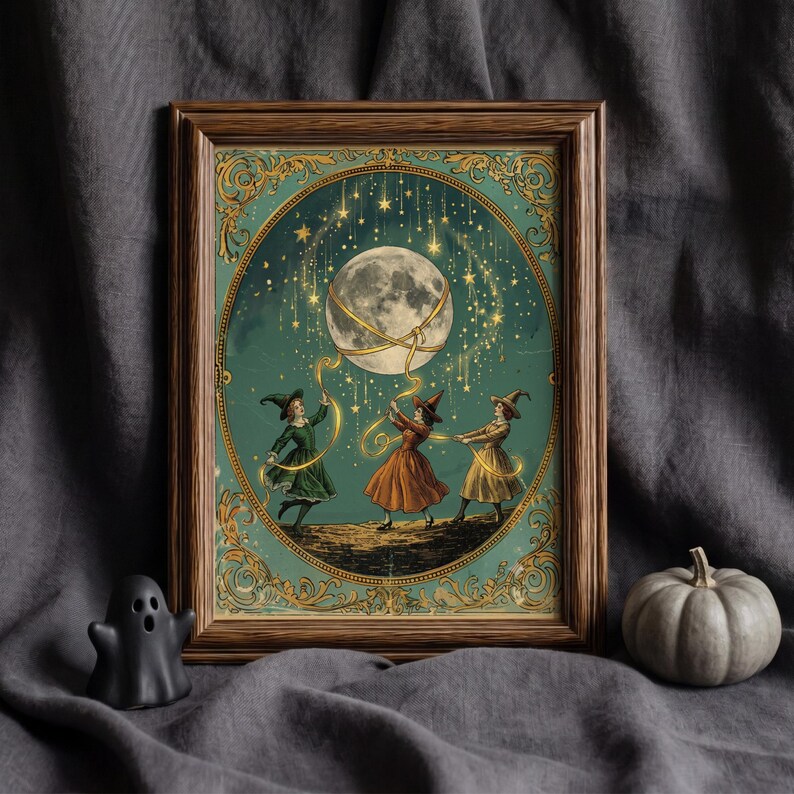 May include: A framed print featuring three figures in pointed hats and dresses dancing on a dark landscape. They hold golden ribbons connected to a large, glowing moon surrounded by falling stars. The artwork is enclosed in an ornate, dark wood frame.