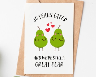 May include: A white card with a pear couple illustration and the text "30 years later and we're still a great pear".