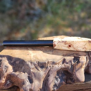 Ferro Rod fire starter with unique wooden handle.