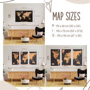 May include: Three different sizes of a scratch-off world map poster. The poster is black with gold foil accents. The sizes are M, L, and XL. The measurements are in inches and centimeters. The poster is displayed on a wall in a living room setting.
