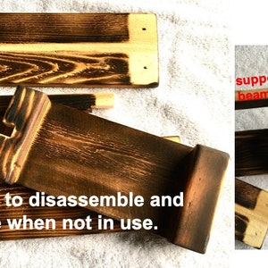 May include: A wooden shelf unit with a burnt finish. The shelf is disassembled and laid flat on a white surface. The shelf is made of multiple pieces of wood that fit together to form a rectangular shape. The shelf is easy to assemble and disassemble, making it easy to store when not in use.