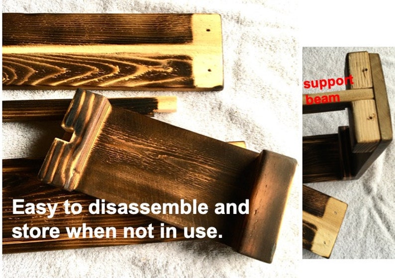 May include: A wooden shelf unit with a burnt finish. The shelf is disassembled and laid flat on a white surface. The shelf is made of multiple pieces of wood that fit together to form a rectangular shape. The shelf is easy to assemble and disassemble, making it easy to store when not in use.