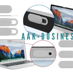 以下が含まれることがあります： スライド式のシルバーウェブカメラカバー。ラップトップとデスクトップコンピュータに表示されています。カバーは長方形で小さなハンドルが付いており、厚さは約1.3mmです。「AAK-BUSINESS」の文字が見えます。
