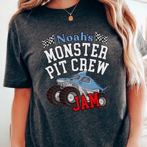 Shark Monster Truck Jam Family Matching T-Shirt. Do you like the megalodon? How about your child? Then you need this one. You can make this a birthday ensemble tee. (See Photo's) You can Customize this one with your name as shown. Pit Crew Party? Yes. This is also a Front back 2-Sided Design which is cool. Put your name and Number on the back. Adult and child sizes in many colors. Really Cool Shirt for son, mom dad sis anyone and all of you.