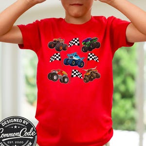 Boy is wearing a red t-shirt with racing monster truck jam theme trucks with checkered racing flags. Very colorful and vibrant colors and vibe. Cool kid tee, perfect for monster truck birthday parties, race day shirt, birthday gift for truck lovers, Christmas gift for boys and men. Perfect Father's day gift of matching dad and son, or matching siblings and boy Mama with son. Adult , teen kids, toddler and baby sizes. Digger, toro bull, tiger shark, blue megalodon, Sparkle Unicorn. Choose design