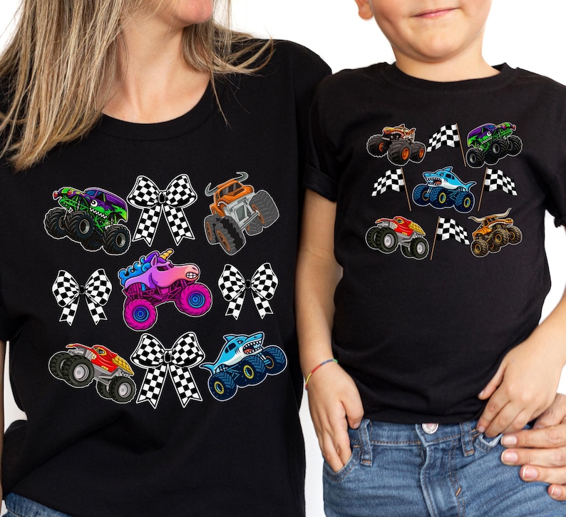 mother and son wearing matching mommy and me shirts in black with monster trucks and checkered race bows on the moms shirt and checkered racing flags on the boy's shirt. Race Day, Birthday Party, Boy Mama gift set outfit for mother and son.