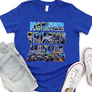 May include: A royal blue t-shirt with a graphic of monster trucks. The text "Monster Trucks Are My Jam" is printed on the shirt. The graphic is made up of images of monster trucks.