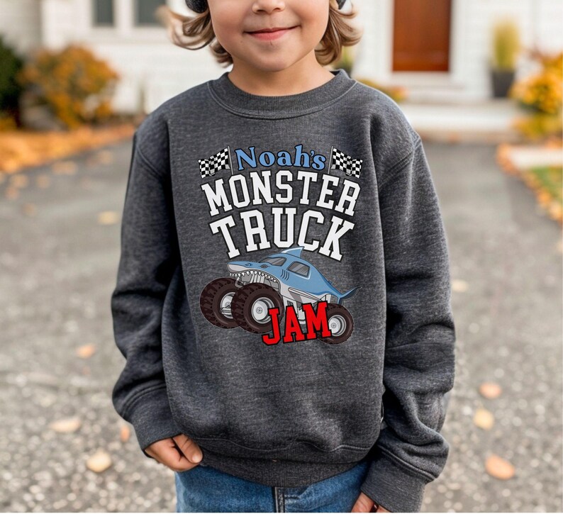 awesome boys birthday monster truck jam shark truck pit crew family matching warm and cozy sweatshirts. When the weather is cool and your little dudes birthday is coming up, this one will be a hit, especially if he likes big monster trucks. Megalodon is cool.
