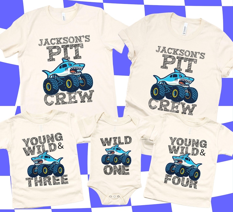 Family Matching Monster Truck T-shirts in Natural Cream Color with Shark Monster Truck Megalodon Cartoon style that have chalk art/sketch style letters that say " Jackson's Pit Crew" Young Wild & Three, Wild One, Young Wild and Four. Perfect for Birthday Gift and Pit Party Race Day T-shirts. Personalized Family Monster Truck Jam Tees.