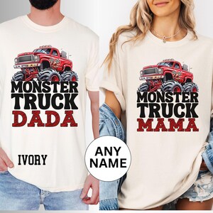 May include: Two white t-shirts with a red monster truck graphic and the text "Monster Truck Dada" and "Monster Truck Mama".