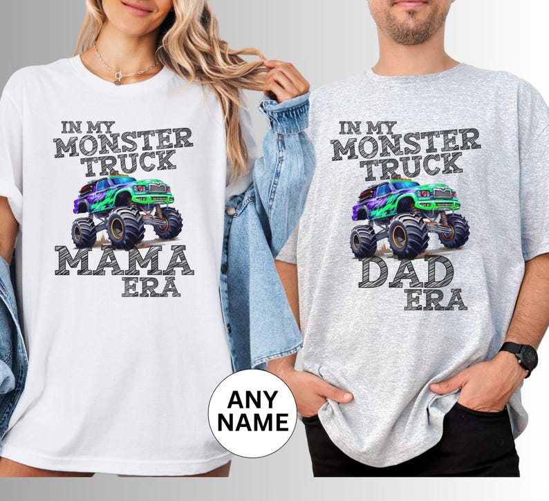 May include: White and grey t-shirts with a monster truck graphic. The white shirt says "In My Monster Truck Mama Era" and the grey shirt says "In My Monster Truck Dad Era". The graphic features a colourful monster truck.