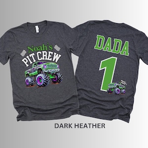 May include: Dark heather gray t-shirts with a monster truck graphic. One shirt says "Noah's Pit Crew" with a green and purple monster truck. The other shirt says "DADA 1" with a matching truck graphic.