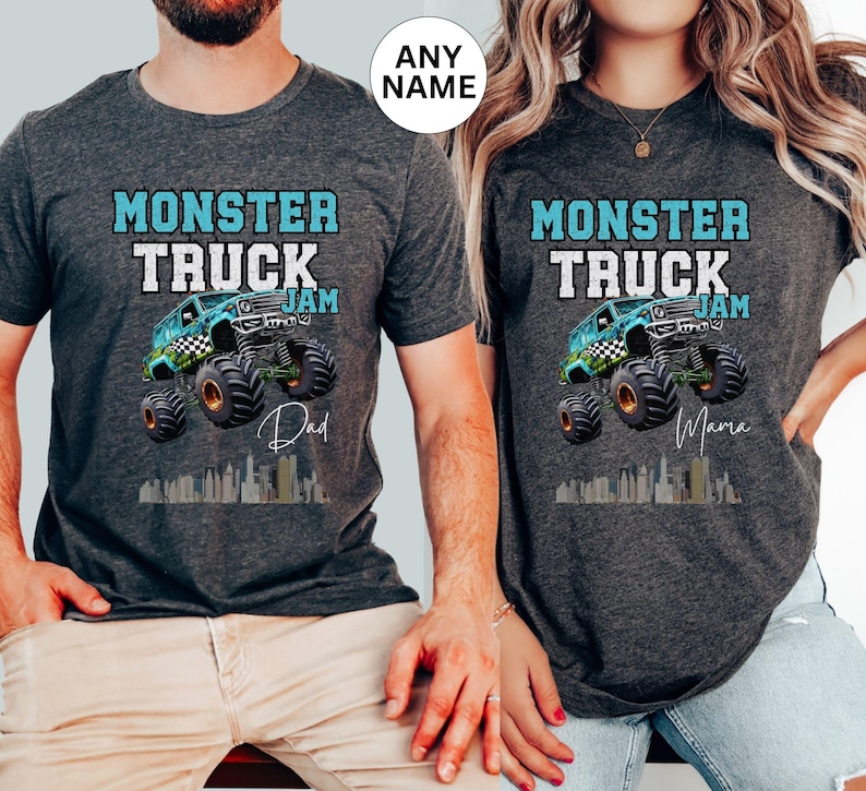 May include: Two grey t-shirts with a blue monster truck graphic and the text "Monster Truck Jam". One shirt says "Dad" and the other says "Mama".