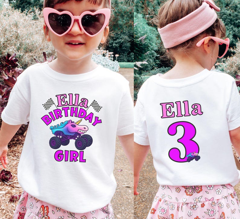 Puede incluir: Camiseta blanca con un gr&aacute;fico colorido que presenta un cami&oacute;n monstruo unicornio y el texto "Ella Birthday Girl". La parte posterior de la camiseta muestra el nombre "Ella" y el n&uacute;mero "3" en rosa.