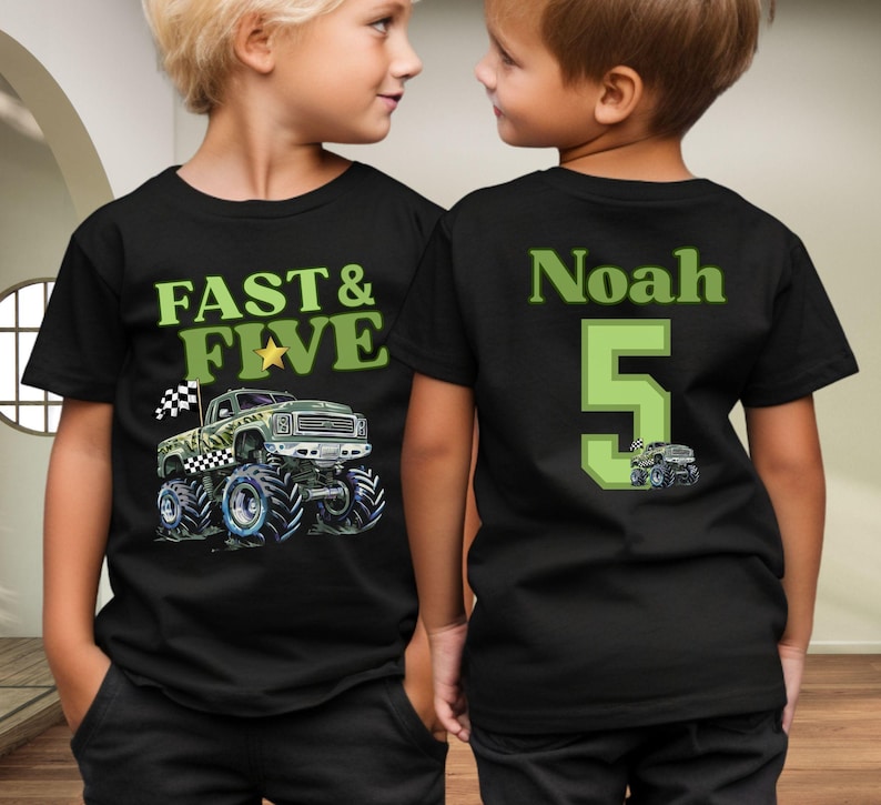 Pictured is a young boy wearing a black 2-sided t-shirt. The front says FAST & FIVE in shades of green along with a camo monster truck, a checkered flag, and a gold star. The back says custom name Noah and a big number 5 in 2 different green colors