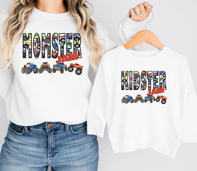 May include: White long-sleeve shirts with a monster truck design. The adult shirt says "Momster Jam" and the child shirt says "Kidster Jam".