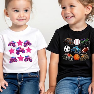 May include: Two children wearing t-shirts. One child wears a white t-shirt with a pattern of pink stars and monster truck unicorns. The other child wears a black t-shirt with a pattern of monster trucks, a baseball, a soccer ball, a basketball, and a football.