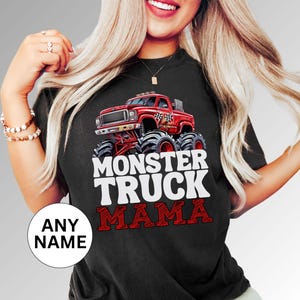 May include: Black t-shirt with a red monster truck graphic and the text "Monster Truck Mama".