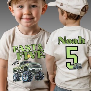Pictured is this little guy wearing a natural beige t-shirt which says FAST & FIVE in two-tone green along with a cool camo monster truck with a checkered flag on the front. On the back is custom name Noah and a big number 5 and a small version of the truck from the front