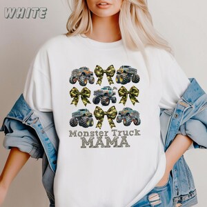 pictured is a Mom in a white comfort colors t-shirt which says Momster Truck Mama with 3 rows of alternating camo coquette bows and monster trucks. great Mothers day Gift