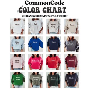 May include: Color chart showing 16 different color options for Gildan 18000 unisex sweatshirts. The colors include white, ash, sport grey, sand, light blue, royal, navy, dark heather, light pink, heliconia, red, maroon, Irish green, military green, forest green, and black.