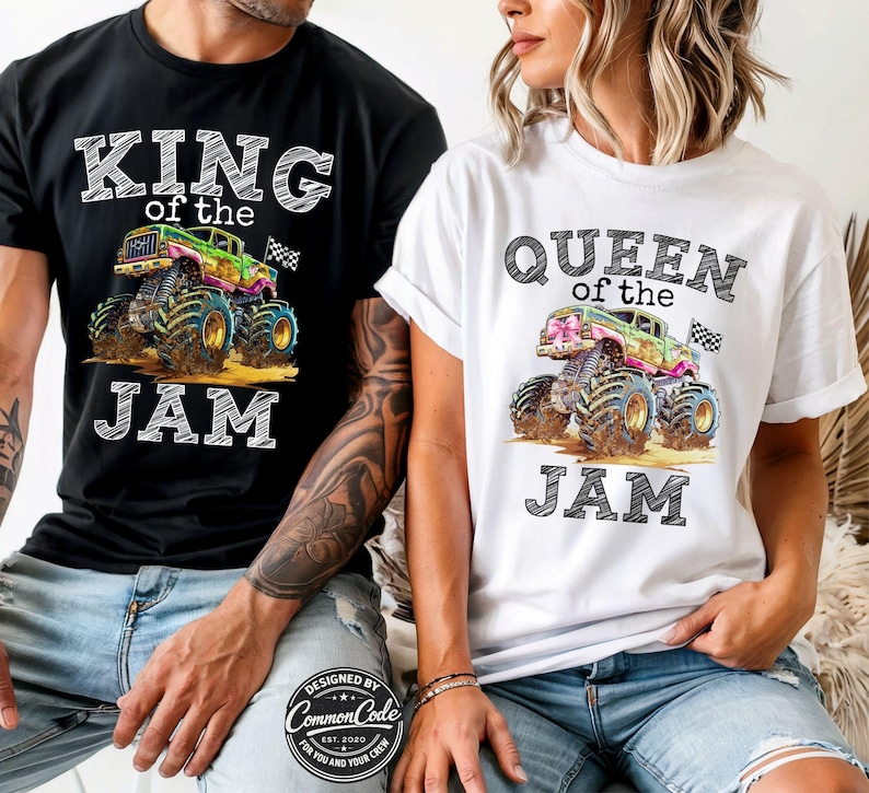 May include: Matching black and white t-shirts with monster truck graphics. One reads "KING of the JAM", the other "QUEEN of the JAM". The trucks are multi-coloured with a checkered flag.