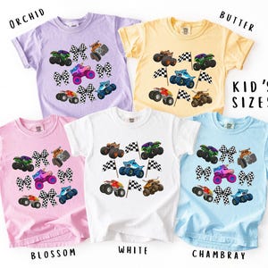 boys and girls comfort colors monster truck tee with checkered racing flags and croquette bows with monster trucks in vibrant fun colorful colors. Racing Vibe tees. Perfect gift for any child or teen truck lover. Boys and girls designs. Personalized.