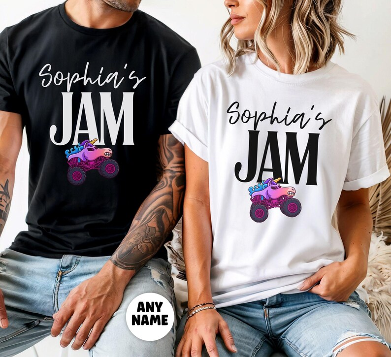 May include: Black and white t-shirts with the text "Sophia's JAM" in a script font. Below the text is a graphic of a monster truck with a unicorn head. The shirts are a casual style.