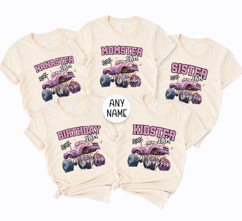 May include: Cream-coloured t-shirts with various designs. Each shirt features a monster truck graphic with the words "NANASTER JAM", "MOMSTER JAM", "SISTER JAM", "BIRTHDAY JAM", and "KIDSTER JAM". The shirts have a playful, family-themed design.