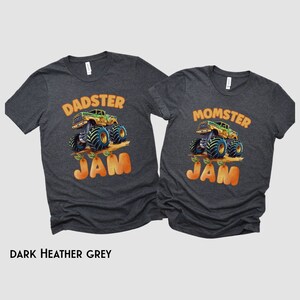 May include: Two dark heather grey t-shirts with a monster truck graphic and the text "DADSTER JAM" and "MOMSTER JAM".