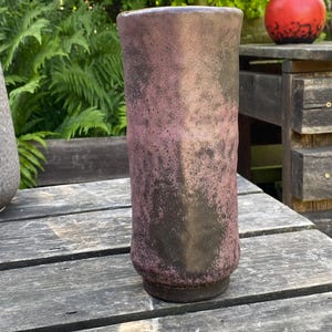 May include: A set of three ceramic mugs with a speckled, matte finish. Each mug is a different colour: light blue, cream, and grey. The mugs have a simple, modern design and a comfortable handle.